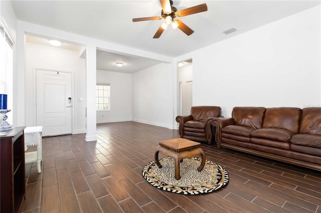 10926 Sand Pine Ln, Parrish, FL 34219 - living room featuring a ceiling fan, dark wood finished floors, and baseboards