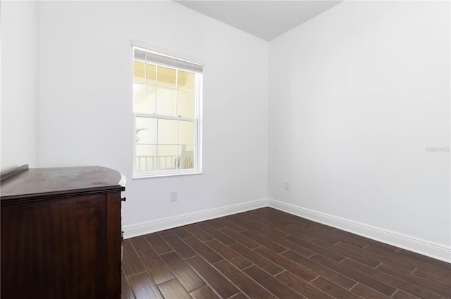10926 Sand Pine Ln, Parrish, FL 34219 - empty room with baseboards and dark wood-style floors