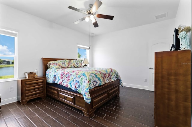 10926 Sand Pine Ln, Parrish, FL 34219 - bedroom featuring baseboards, dark wood-style floors, and ceiling fan