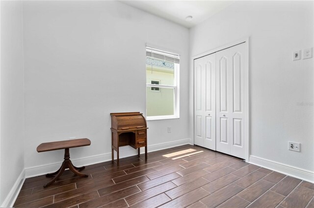 10926 Sand Pine Ln, Parrish, FL 34219 - bedroom featuring wood tiled floors, a closet, and baseboards