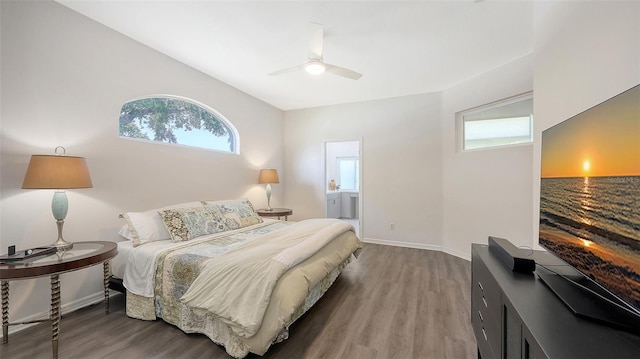 6721 Oak Manor Dr, Lakewood Ranch, FL 34202 - bedroom featuring wood finished floors, baseboards, a ceiling fan, and connected bathroom