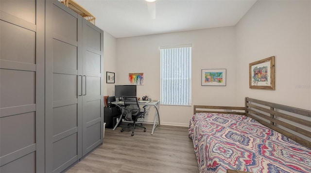 6721 Oak Manor Dr, Lakewood Ranch, FL 34202 - bedroom featuring light wood-type flooring, baseboards, and a desk