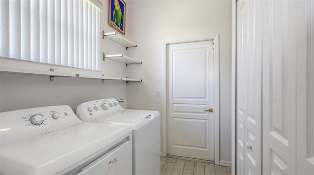 6721 Oak Manor Dr, Lakewood Ranch, FL 34202 - washroom with independent washer and dryer and light wood-type flooring