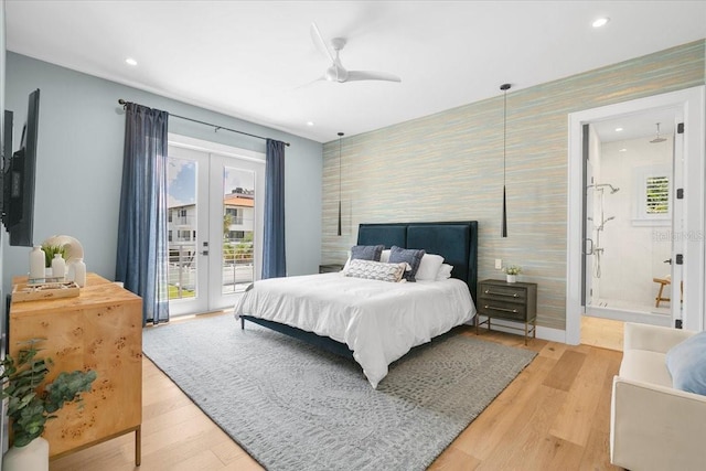 bedroom with an accent wall, access to outside, wallpapered walls, french doors, and recessed lighting
