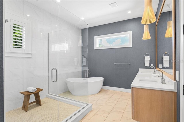 bathroom with a shower stall, marble look tile flooring, double vanity, a freestanding bath, and baseboards