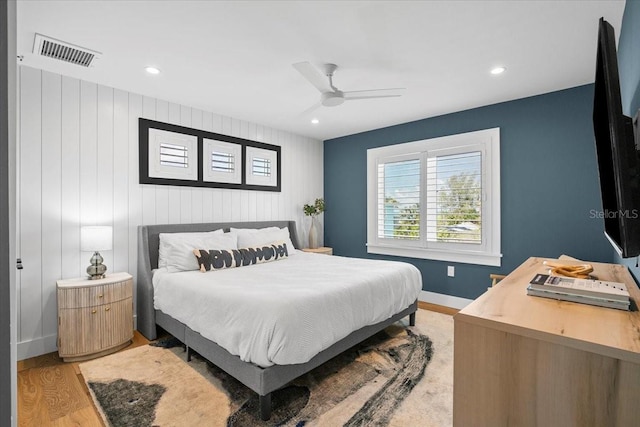 bedroom with light wood-type flooring, baseboards, ceiling fan, and recessed lighting