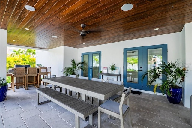 view of patio featuring french doors and outdoor dining area