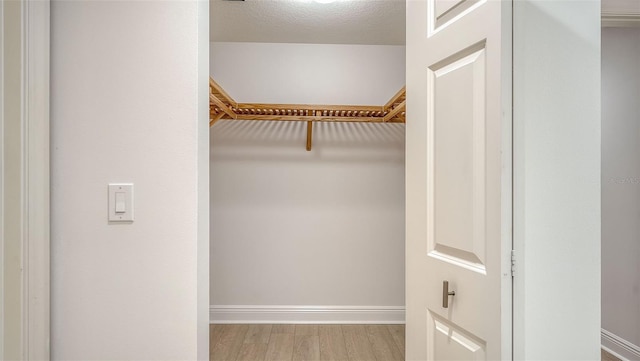 800 N Tamiami Trl Unit 317, Sarasota, FL 34236 - walk in closet with wood finished floors