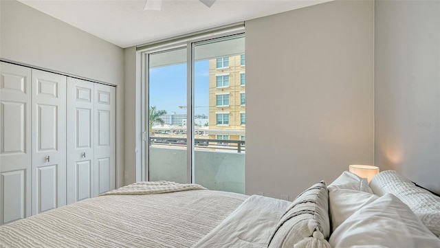 800 N Tamiami Trl Unit 317, Sarasota, FL 34236 - bedroom featuring access to exterior, a closet, expansive windows, and ceiling fan