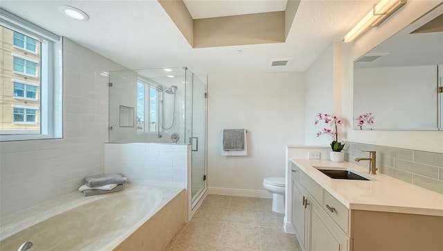 800 N Tamiami Trl Unit 317, Sarasota, FL 34236 - full bathroom featuring baseboards, toilet, vanity, a bath, and a stall shower