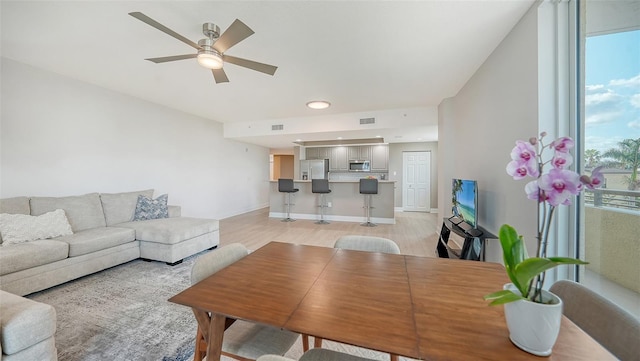 800 N Tamiami Trl Unit 317, Sarasota, FL 34236 - living room featuring light wood-style floors, a ceiling fan, and recessed lighting