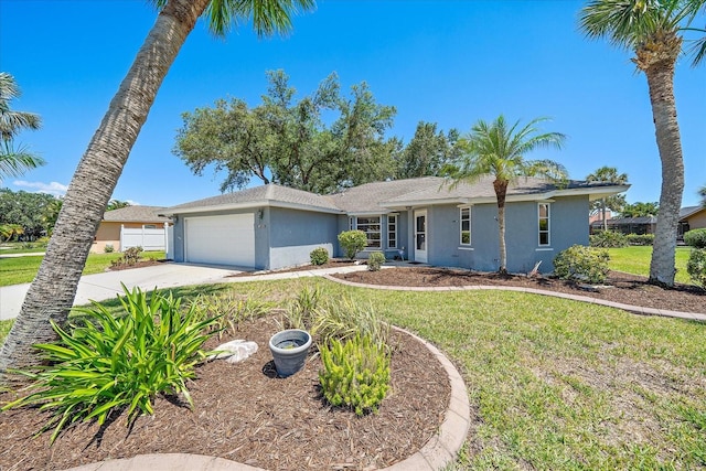3335 Meadow Run Ter, Venice, FL 34293 - ranch-style home with stucco siding, an attached garage, driveway, and a front lawn