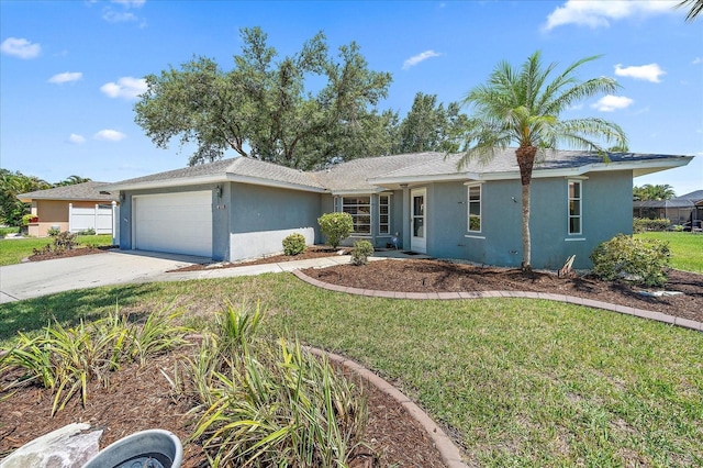 3335 Meadow Run Ter, Venice, FL 34293 - single story home featuring stucco siding, a garage, driveway, and a front lawn