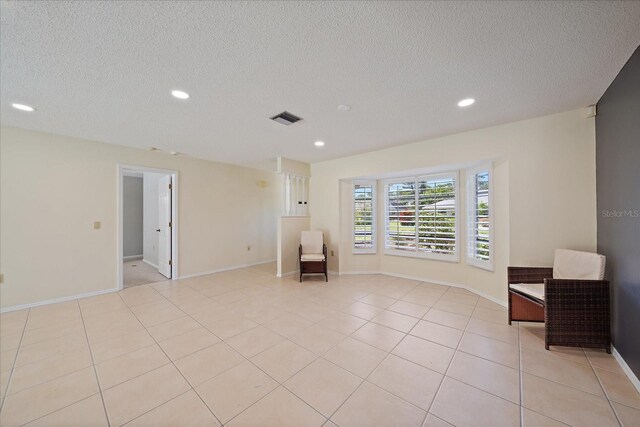 3335 Meadow Run Ter, Venice, FL 34293 - unfurnished room with recessed lighting, a textured ceiling, light tile patterned floors, and baseboards