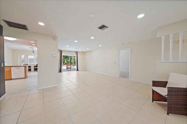 3335 Meadow Run Ter, Venice, FL 34293 - unfurnished living room with recessed lighting, light tile patterned flooring, and baseboards
