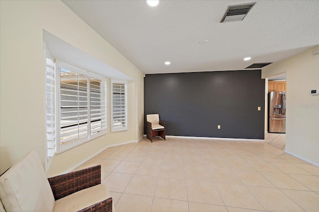 3335 Meadow Run Ter, Venice, FL 34293 - unfurnished room featuring recessed lighting, light tile patterned floors, a textured ceiling, and baseboards