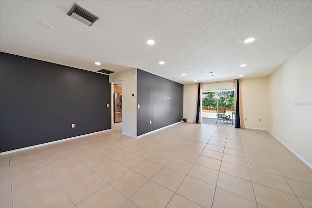 3335 Meadow Run Ter, Venice, FL 34293 - unfurnished room with a textured ceiling, recessed lighting, light tile patterned flooring, and baseboards