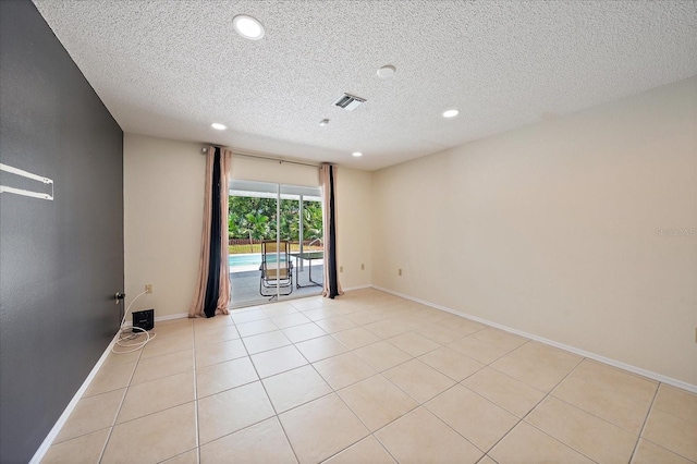 3335 Meadow Run Ter, Venice, FL 34293 - spare room with recessed lighting, a textured ceiling, light tile patterned floors, and baseboards