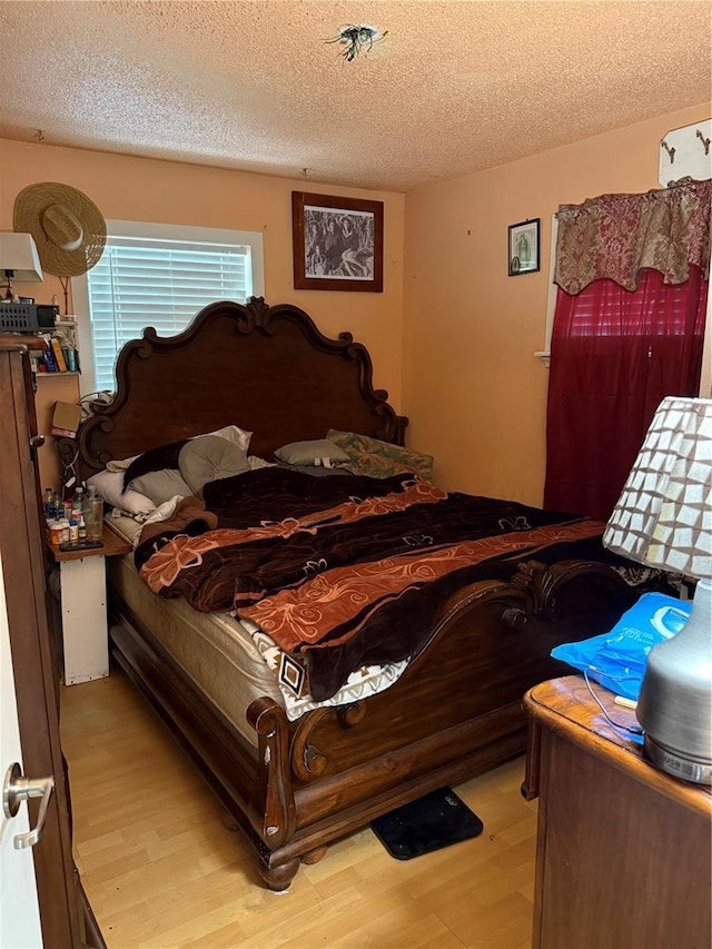 3720 27th St E, Bradenton, FL 34208 - bedroom featuring light wood-style flooring and a textured ceiling