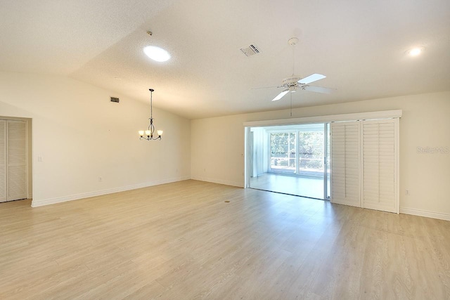 5812 Garden Lakes Fern, Bradenton, FL 34203 - empty room featuring ceiling fan, lofted ceiling, baseboards, light wood-type flooring, and a chandelier