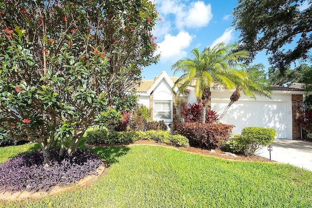 5812 Garden Lakes Fern, Bradenton, FL 34203 - view of front facade featuring a garage, a front yard, and driveway