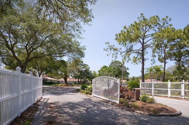 5812 Garden Lakes Fern, Bradenton, FL 34203 - view of asphalt street featuring a gate