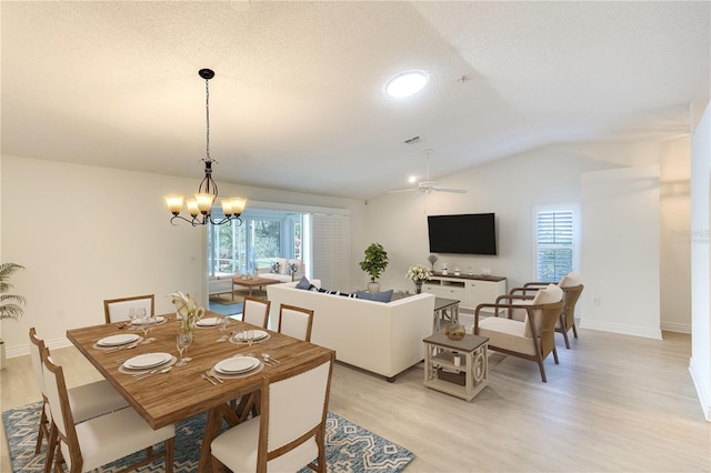 5812 Garden Lakes Fern, Bradenton, FL 34203 - dining space featuring vaulted ceiling, light wood-type flooring, a ceiling fan, a chandelier, and baseboards