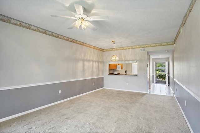 8755 Olde Hickory Ave Unit 7105, Sarasota, FL 34238 - unfurnished living room featuring carpet floors, a ceiling fan, a textured ceiling, baseboards, and a sink