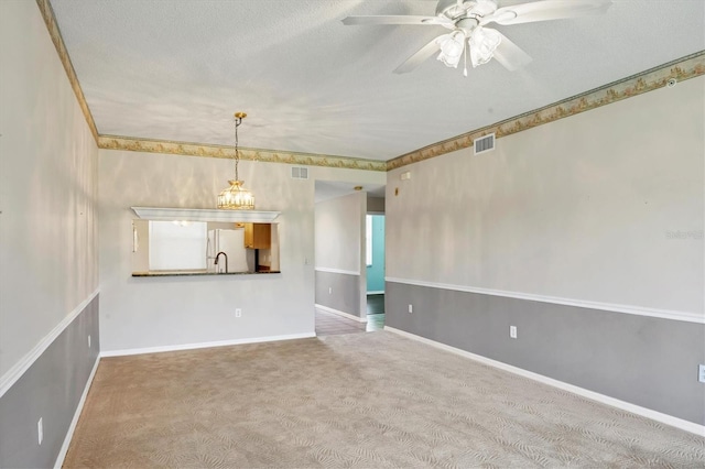 8755 Olde Hickory Ave Unit 7105, Sarasota, FL 34238 - empty room with carpet floors, a ceiling fan, baseboards, and a textured ceiling