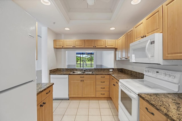 8755 Olde Hickory Ave Unit 7105, Sarasota, FL 34238 - kitchen with white appliances, a sink, a raised ceiling, crown molding, and light brown cabinets