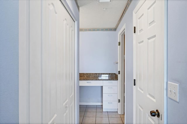 8755 Olde Hickory Ave Unit 7105, Sarasota, FL 34238 - hall with light tile patterned floors and a textured ceiling
