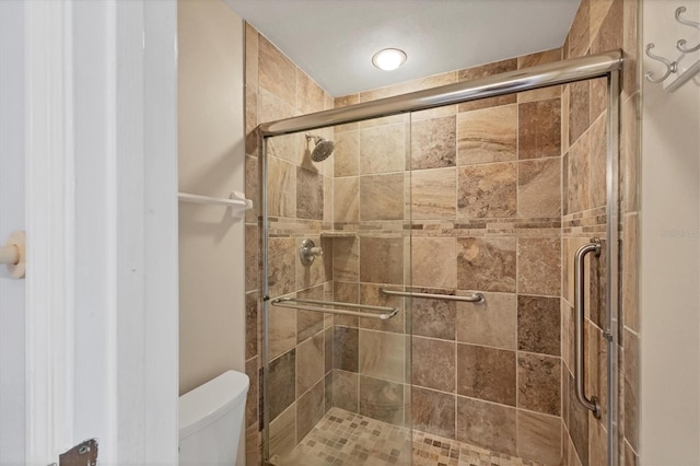 8755 Olde Hickory Ave Unit 7105, Sarasota, FL 34238 - bathroom featuring toilet and a stall shower