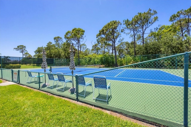 8755 Olde Hickory Ave Unit 7105, Sarasota, FL 34238 - view of tennis court featuring fence