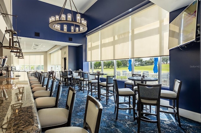 8755 Olde Hickory Ave Unit 7105, Sarasota, FL 34238 - dining area featuring a towering ceiling and a chandelier
