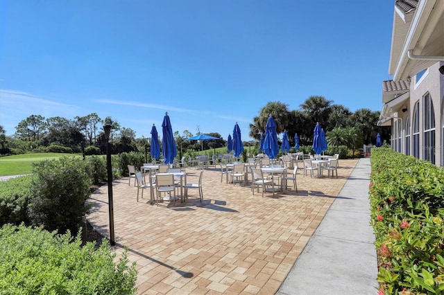 8755 Olde Hickory Ave Unit 7105, Sarasota, FL 34238 - view of home's community featuring outdoor dining area and a patio