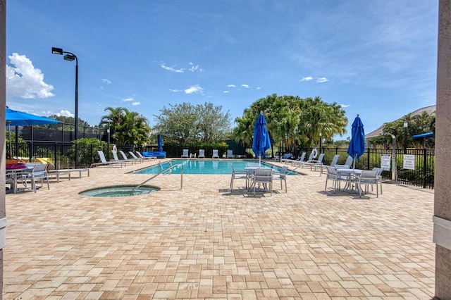 8755 Olde Hickory Ave Unit 7105, Sarasota, FL 34238 - community pool with fence, a patio, and a community hot tub