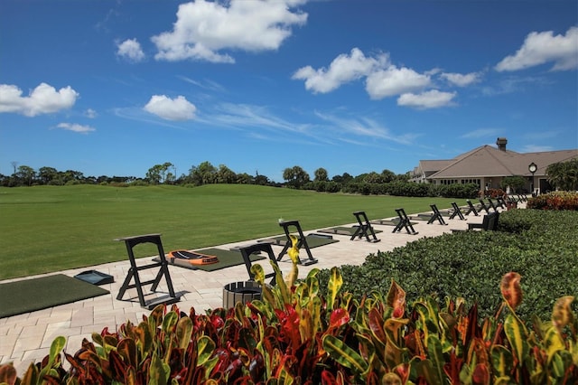 8755 Olde Hickory Ave Unit 7105, Sarasota, FL 34238 - surrounding community featuring a lawn and a patio area