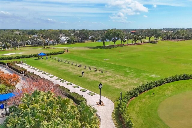 8755 Olde Hickory Ave Unit 7105, Sarasota, FL 34238 - view of home's community with view of golf course and view of wooded area