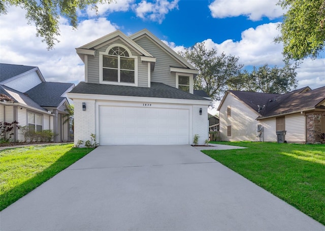 1839 Cranberry Isles Way, Apopka, FL 32712 - traditional home featuring brick siding, driveway, a garage, and a front yard