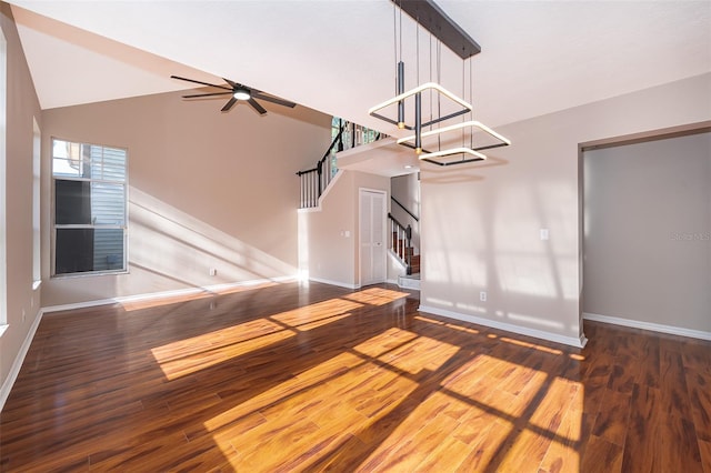 1839 Cranberry Isles Way, Apopka, FL 32712 - unfurnished living room featuring baseboards, stairs, wood finished floors, a chandelier, and high vaulted ceiling