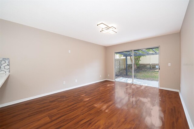 1839 Cranberry Isles Way, Apopka, FL 32712 - empty room featuring wood finished floors and baseboards