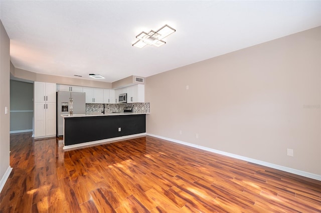 1839 Cranberry Isles Way, Apopka, FL 32712 - unfurnished living room with wood finished floors, baseboards, and a sink