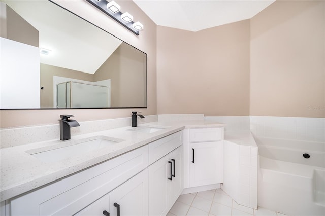 1839 Cranberry Isles Way, Apopka, FL 32712 - full bathroom featuring a bath, a shower stall, tile patterned flooring, and double vanity