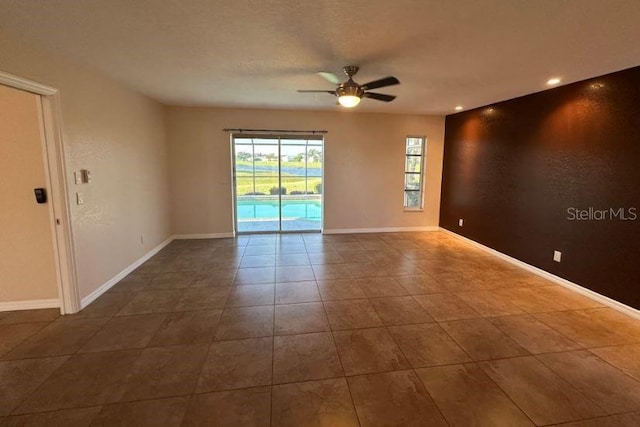 2178 Calcutta Rd, Punta Gorda, FL 33983 - spare room featuring a ceiling fan, dark tile patterned floors, baseboards, and recessed lighting