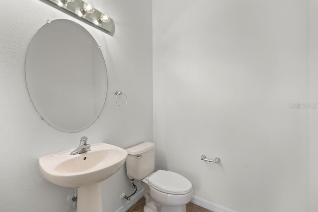 4429 67th St E, Bradenton, FL 34203 - bathroom with toilet and baseboards