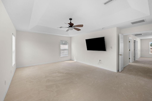 4429 67th St E, Bradenton, FL 34203 - unfurnished living room featuring light carpet, a ceiling fan, and healthy amount of natural light