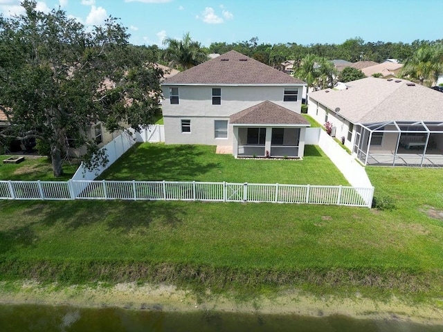 4429 67th St E, Bradenton, FL 34203 - back of property featuring a sunroom, stucco siding, and a shingled roof