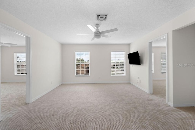 4429 67th St E, Bradenton, FL 34203 - unfurnished room with ceiling fan, light carpet, baseboards, and a textured ceiling