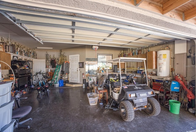 garage featuring water heater and a workshop area