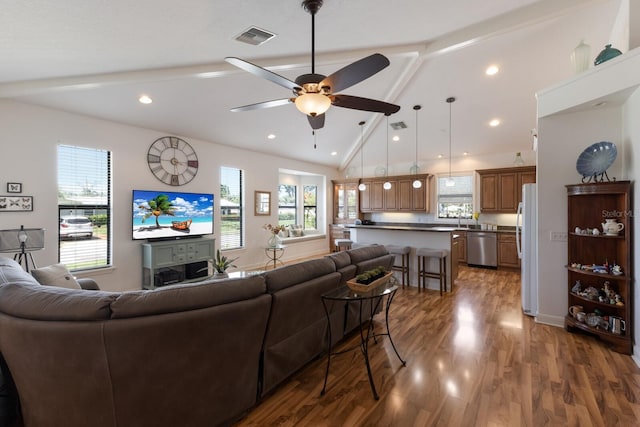 living area featuring a ceiling fan, dark wood-style floors, healthy amount of natural light, and recessed lighting